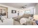 Bright living room with modern decor, a large sectional sofa, and an open layout for seamless entertaining at 187 Palm Fox Ct, Henderson, NV 89011