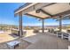 Outdoor entertainment area featuring a built-in kitchen, seating, and scenic views at 187 Palm Fox Ct, Henderson, NV 89011
