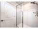 Modern walk-in shower featuring glass doors and dual shower heads in a bright bathroom at 187 Palm Fox Ct, Henderson, NV 89011