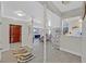 Bright entryway with stone floors, open layout, and views into the living room and kitchen at 1904 Chapman Dr, Las Vegas, NV 89104