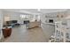Open-concept living room with a cozy fireplace, tile flooring, and stylish furnishings at 1904 Chapman Dr, Las Vegas, NV 89104