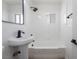 Modern bathroom features a pedestal sink and shower with contemporary fixtures at 2 Utah Way, Henderson, NV 89015