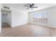 Bright, spacious bedroom with large window and hardwood floors at 2 Utah Way, Henderson, NV 89015