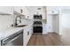 Modern kitchen features stainless steel appliances, white cabinets, and open layout at 2 Utah Way, Henderson, NV 89015