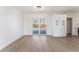 Bright, airy living room features sliding doors, modern light fixture, and stylish flooring at 2 Utah Way, Henderson, NV 89015