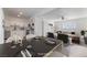Open-concept living and dining area with modern decor and plenty of natural light at 2 Utah Way, Henderson, NV 89015