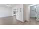 Bright living room featuring hardwood floors, storage cabinets, and glass doors to the backyard at 2 Utah Way, Henderson, NV 89015