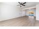 Spacious open-concept living area with hardwood floors and view to the backyard pool at 2 Utah Way, Henderson, NV 89015
