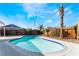 Relaxing pool with clear blue water, surrounded by desert landscaping and bright sunshine at 2 Utah Way, Henderson, NV 89015