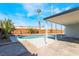 Refreshing backyard pool with blue trim surrounded by a concrete patio and tropical plants at 2 Utah Way, Henderson, NV 89015