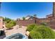 Backyard featuring desert landscaping, a brick privacy wall, and an air conditioning unit in the corner at 2101 High Mesa Dr, Henderson, NV 89012