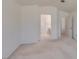 Neutral carpeted bedroom with ensuite bathroom and a door to the hallway at 2101 High Mesa Dr, Henderson, NV 89012