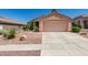 Charming single-story home showcasing a well-kept yard and attached two-car garage at 2101 High Mesa Dr, Henderson, NV 89012