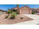 Charming single-story home showcasing a well-kept yard and attached two-car garage at 2101 High Mesa Dr, Henderson, NV 89012