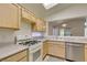 Cozy kitchen featuring ample counter space, light wood cabinets, and bright lighting at 2101 High Mesa Dr, Henderson, NV 89012
