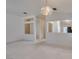 Living room featuring carpet flooring, multiple windows and a view into the kitchen at 2101 High Mesa Dr, Henderson, NV 89012