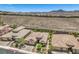 Stunning aerial perspective of a desert neighborhood highlighting the community's layout and surrounding landscape at 2509 Chateau Napoleon Dr, Henderson, NV 89044