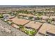 Community aerial view featuring a collection of homes with spacious yards, manicured landscaping, and scenic desert surroundings at 2509 Chateau Napoleon Dr, Henderson, NV 89044