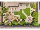 A top-down view of the backyard which features desert landscaping, an outdoor kitchen, a firepit, and artificial grass at 2509 Chateau Napoleon Dr, Henderson, NV 89044