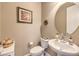 Elegant powder room with modern fixtures, a vessel sink, and tastefully selected decorations at 2509 Chateau Napoleon Dr, Henderson, NV 89044