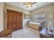 Bedroom with antique furnishings, natural light from a window, and a comfortable bed at 2509 Chateau Napoleon Dr, Henderson, NV 89044