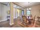 Elegant dining room with hardwood floors, coffered ceilings, and a chandelier, perfect for gatherings at 2509 Chateau Napoleon Dr, Henderson, NV 89044