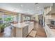 Beautiful kitchen with large island, stainless appliances and an open floorplan with a fireplace at 2509 Chateau Napoleon Dr, Henderson, NV 89044