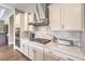 Modern kitchen features stainless steel appliances, granite counters, and white cabinets at 2509 Chateau Napoleon Dr, Henderson, NV 89044