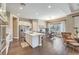 Gourmet kitchen with center island, stainless appliances, and views of the dining area and backyard at 2509 Chateau Napoleon Dr, Henderson, NV 89044