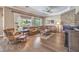 Beautiful living room featuring hardwood floors, a stacked stone fireplace and large picture window at 2509 Chateau Napoleon Dr, Henderson, NV 89044