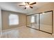 Bedroom with wood flooring, ceiling fan and closet with mirrored doors at 2633 S Durango Dr # 202, Las Vegas, NV 89117