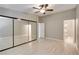 Spacious bedroom with wood flooring, ceiling fan and closet with mirrored doors at 2633 S Durango Dr # 202, Las Vegas, NV 89117