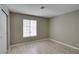 Neutral bedroom with a window providing natural light and modern floors at 2633 S Durango Dr # 202, Las Vegas, NV 89117