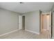 Bright bedroom with closet space, neutral walls, and wood-look flooring at 2633 S Durango Dr # 202, Las Vegas, NV 89117