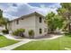 Condo exterior with desert landscaping and mature trees on a sunny day at 2633 S Durango Dr # 202, Las Vegas, NV 89117