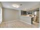 A kitchen with stainless steel appliances, light gray cabinets and wood floors at 2633 S Durango Dr # 202, Las Vegas, NV 89117