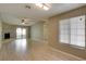 Open concept living space featuring fireplace, vaulted ceiling, and sliding glass door to balcony at 2633 S Durango Dr # 202, Las Vegas, NV 89117