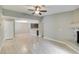 A spacious living room with wood floors, ceiling fan, fireplace, and an open layout at 2633 S Durango Dr # 202, Las Vegas, NV 89117