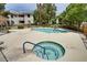 Community pool area with a hot tub, surrounded by lush landscaping at 2633 S Durango Dr # 202, Las Vegas, NV 89117