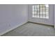 Empty bedroom features plush carpet and a bright window at 2865 Destino Ln, Henderson, NV 89074