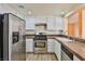 Updated kitchen features stainless steel appliances and modern cabinets at 2865 Destino Ln, Henderson, NV 89074