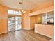 Bright living room features new floors, sliding glass doors and stylish lighting fixture at 2865 Destino Ln, Henderson, NV 89074