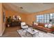 Staged living room showcases modern furniture and a light-filled, airy feel at 2865 Destino Ln, Henderson, NV 89074