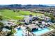 Aerial view of the community clubhouse with pools, tennis courts, and a golf course at 30 Strada Di Villaggio # 118, Henderson, NV 89011