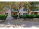 A charming courtyard with gravel, a small bench, and patio at 30 Strada Di Villaggio # 118, Henderson, NV 89011