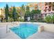 Community hot tub with beautiful tiling and surrounding landscaping at 30 Strada Di Villaggio # 118, Henderson, NV 89011
