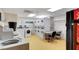 Bright laundry room with multiple washers, dryers, and folding table for residents at 30 Strada Di Villaggio # 118, Henderson, NV 89011