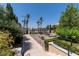 Community pool entrance with pathway and garden views at 30 Strada Di Villaggio # 118, Henderson, NV 89011
