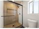 Modern bathroom boasts a glass shower with sleek black hardware and tiled niche at 307 Balsa St, Henderson, NV 89002