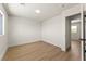 Bright bedroom with wood floors, neutral walls, and ensuite access at 307 Balsa St, Henderson, NV 89002
